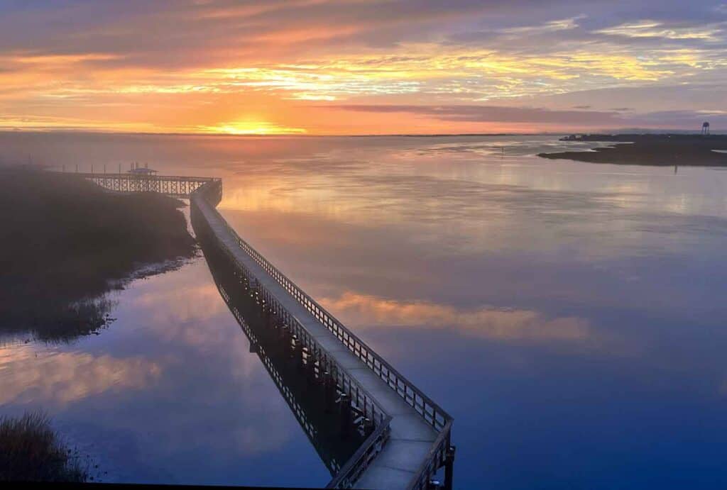 sunrises in the low country are a deep blue and bright orange reflecting off the water it makes a beautiful vacation