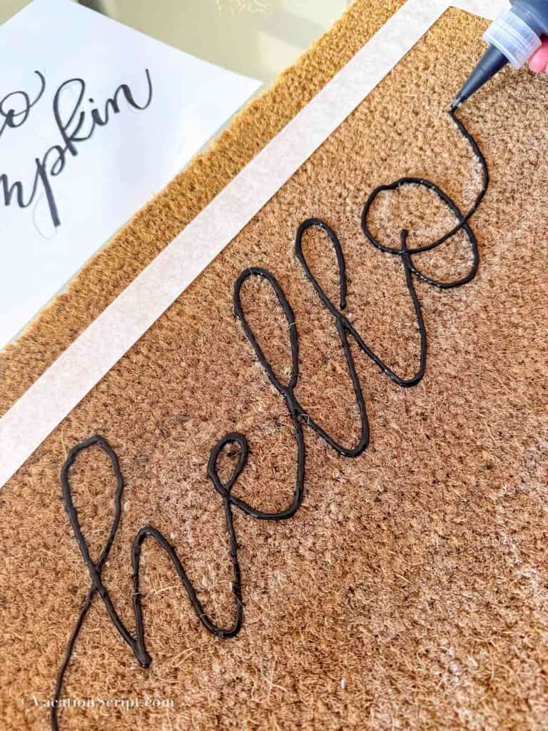 hello written in with paint on doormat