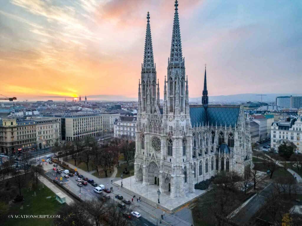 sunset behind the votive church in vienna
