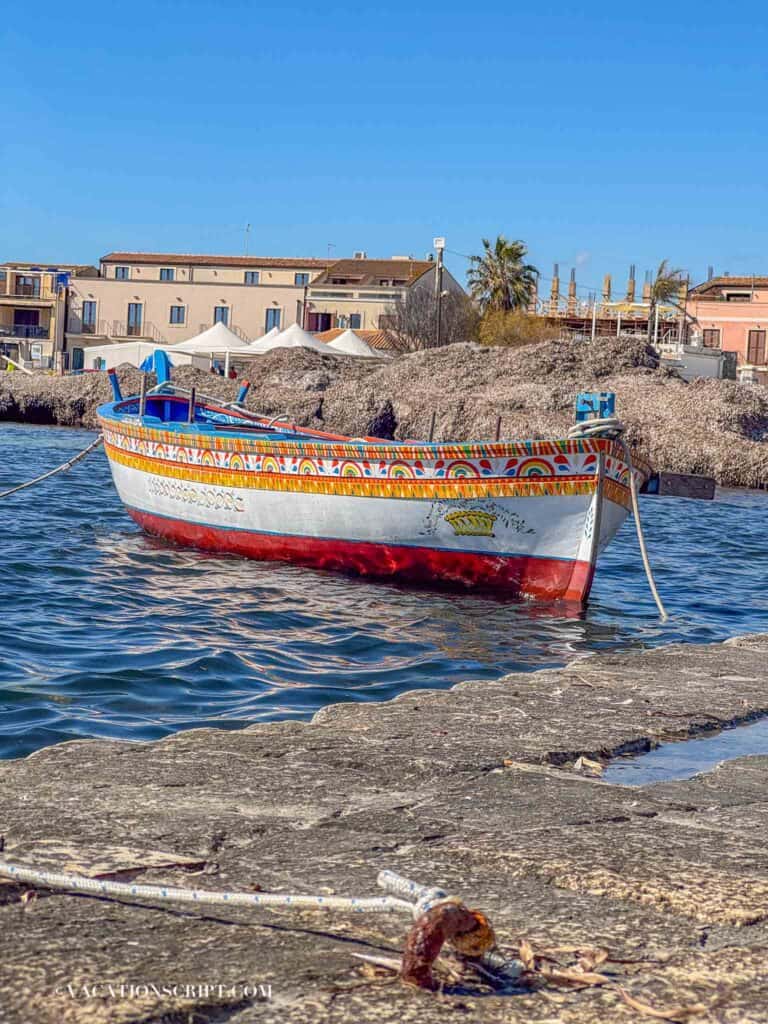 Fishing boats in Marzamemi’s harbor under a bright Sicilian sky