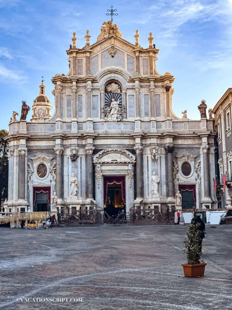 The Cathedral of Sant’Agata in Catania decorated with vibrant red drapes during the Festival of Sant’Agata, showcasing its grand architecture in full glory.