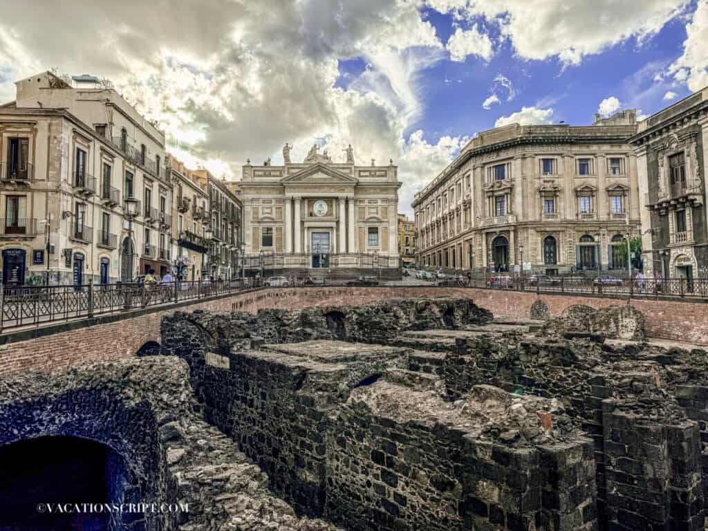View of Chiesa di San Biagio in Sant'Agata alla Fornace with the sunken ruins of the Roman amphitheatre of Catania in the foreground.