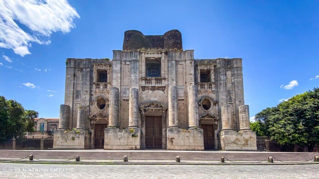 The Benedictine Monastery of San Nicolò l'Arena, standing tall under a clear blue sky on a sunny day is a great thing to see in Catania.